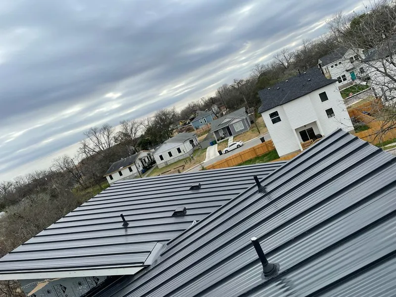 Standing seam metal roof panels with vents for Skylight Repair in Harvard
